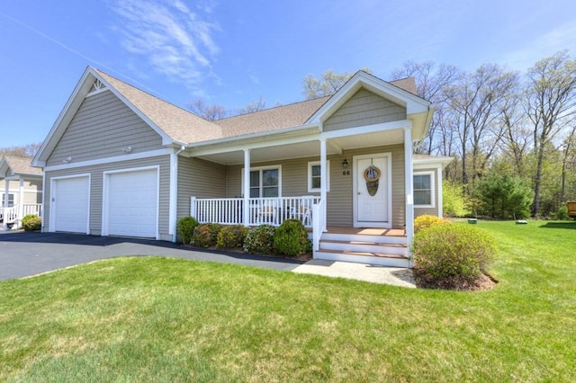 view of front of home with a garage, aphalt driveway, covered porch, a front yard, and roof with shingles
