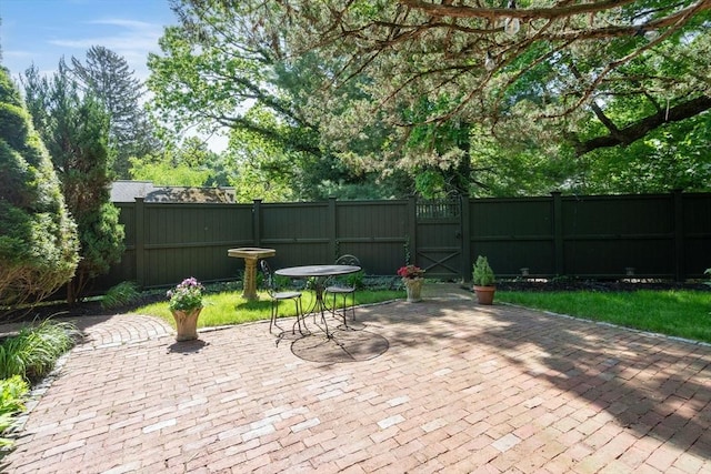 view of patio / terrace with a gate and fence