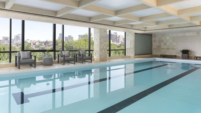 indoor pool with a city view