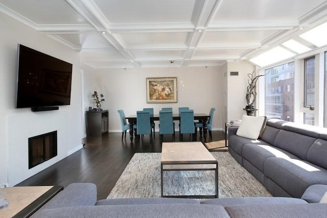 living room featuring wood finished floors, baseboards, coffered ceiling, beamed ceiling, and a fireplace