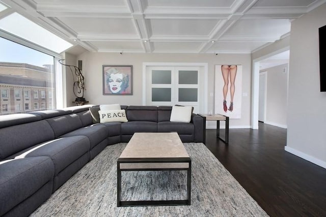 living area featuring baseboards, dark wood-style flooring, coffered ceiling, and beamed ceiling