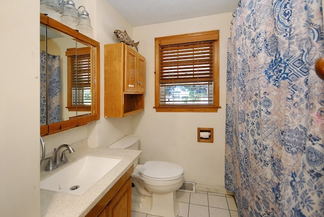 bathroom with curtained shower, tile patterned flooring, vanity, and toilet