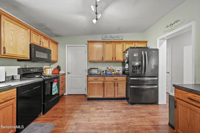 32 Scott Rd, Savoy, MA 01256 - kitchen with black appliances, dark countertops, and light wood-style floors