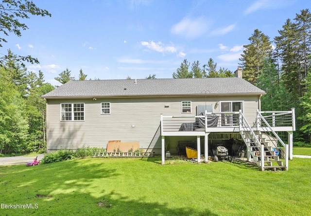 32 Scott Rd, Savoy, MA 01256 - rear view of house featuring a wooden deck, a lawn, stairway, and a chimney