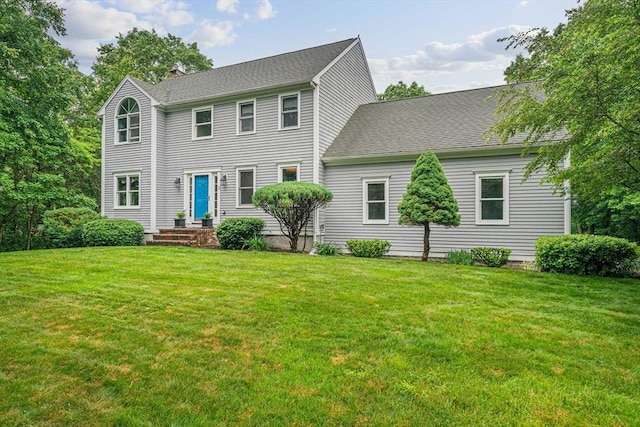 9 Captains Way E, Bridgewater, MA 02333 - colonial inspired home featuring a chimney, a front yard, and a shingled roof
