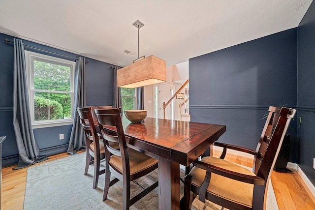 9 Captains Way E, Bridgewater, MA 02333 - dining area featuring light wood-type flooring and stairway