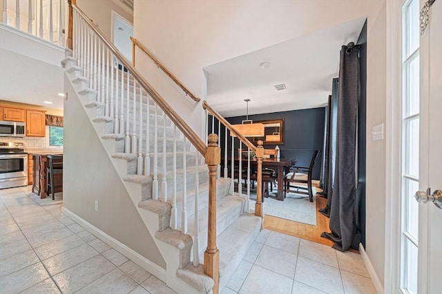 9 Captains Way E, Bridgewater, MA 02333 - stairway featuring tile patterned flooring and recessed lighting