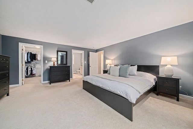 9 Captains Way E, Bridgewater, MA 02333 - bedroom featuring light colored carpet, a walk in closet, ensuite bathroom, and a closet