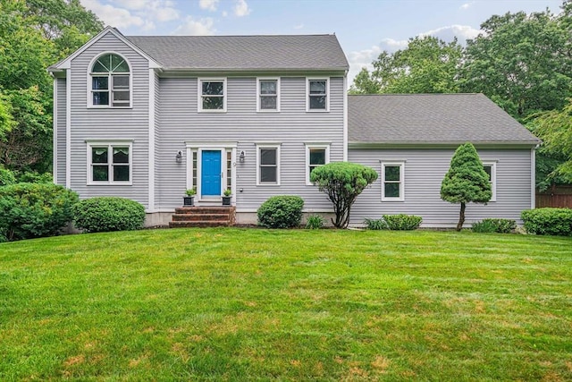 9 Captains Way E, Bridgewater, MA 02333 - colonial-style house featuring a front yard and a shingled roof