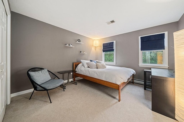9 Captains Way E, Bridgewater, MA 02333 - carpeted bedroom featuring baseboards and a baseboard heating unit