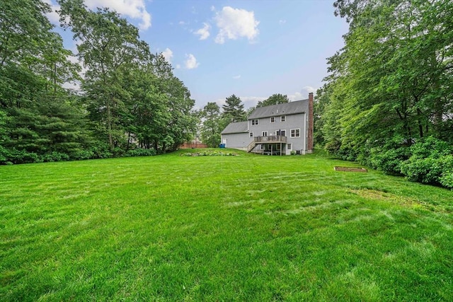 9 Captains Way E, Bridgewater, MA 02333 - view of green lawn with stairway and a wooden deck