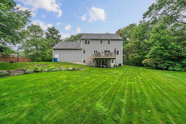 9 Captains Way E, Bridgewater, MA 02333 - rear view of property featuring a chimney, a wooden deck, and stairs