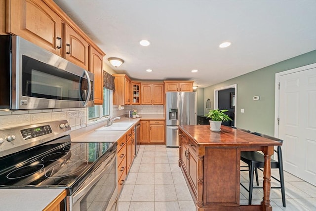 9 Captains Way E, Bridgewater, MA 02333 - kitchen featuring stainless steel appliances, tasteful backsplash, wood counters, glass insert cabinets, and recessed lighting