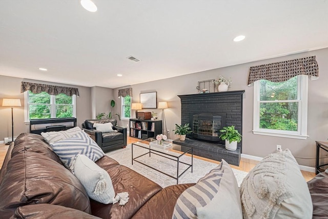 9 Captains Way E, Bridgewater, MA 02333 - living area featuring recessed lighting, wood finished floors, and a brick fireplace