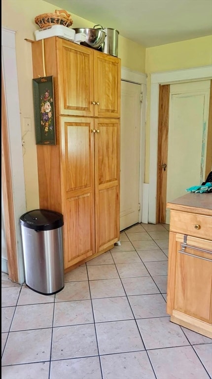 kitchen with light tile patterned flooring