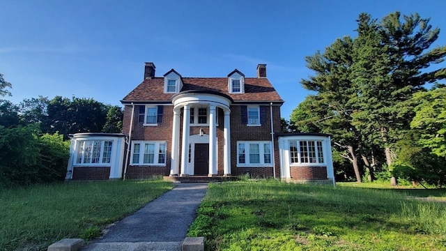 view of front of home with a front yard