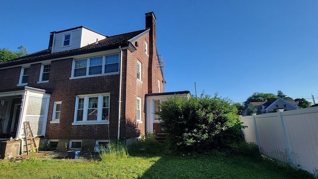 view of home's exterior featuring a lawn