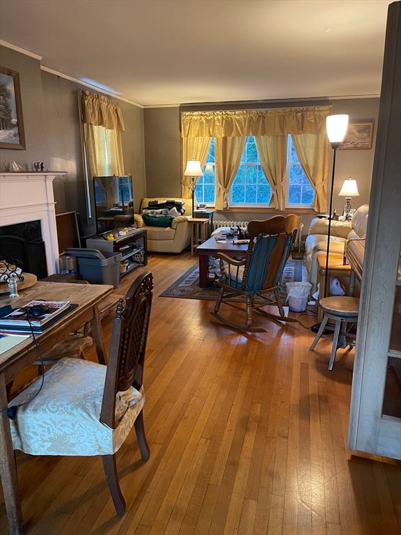 office featuring hardwood / wood-style floors and ornamental molding