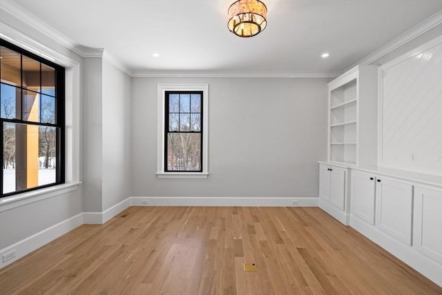 unfurnished room with light hardwood / wood-style floors and ornamental molding