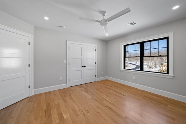 unfurnished bedroom featuring ceiling fan and light hardwood / wood-style flooring