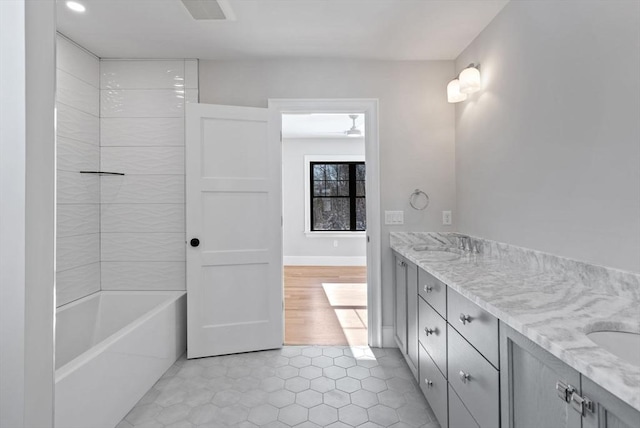 bathroom featuring tile patterned flooring and vanity