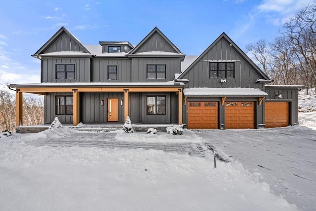 view of front of home featuring covered porch and a garage