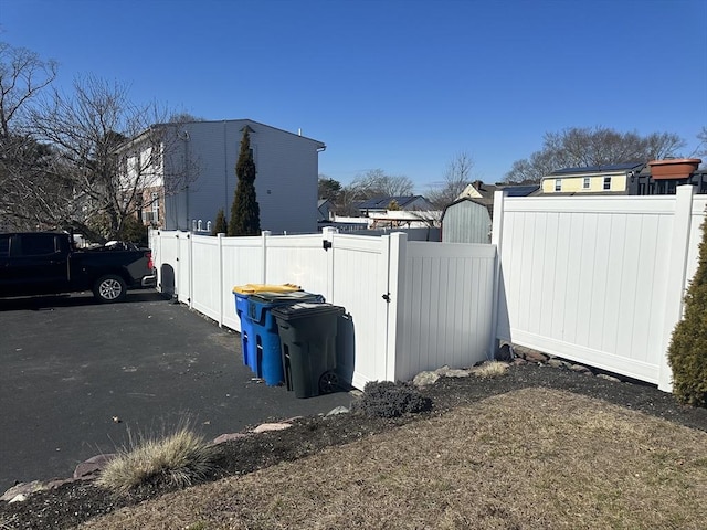 exterior space featuring fence and a gate