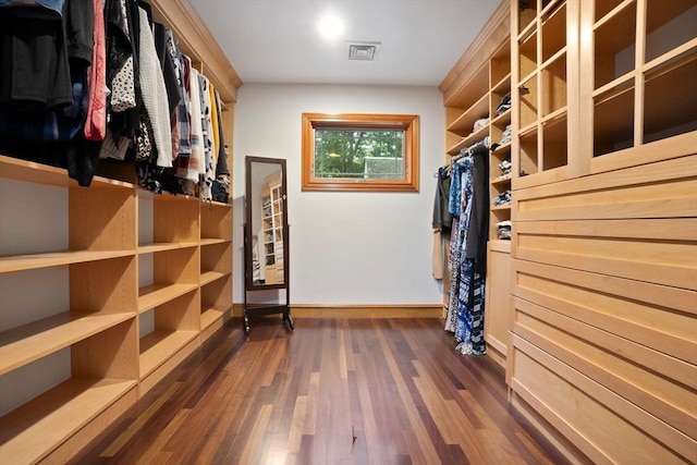 spacious closet featuring dark wood finished floors and visible vents