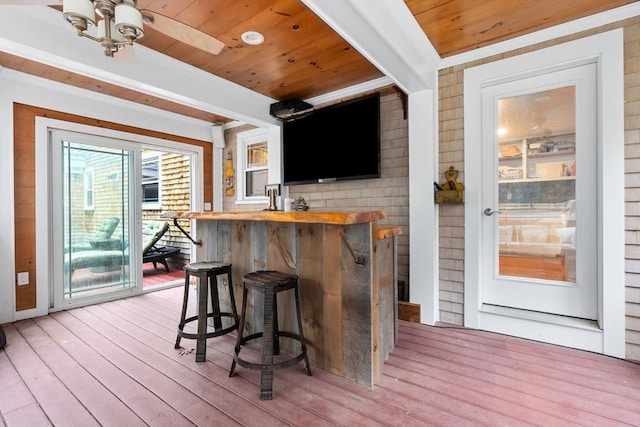 bar featuring wood ceiling, light wood finished floors, and beamed ceiling