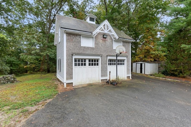 garage featuring a storage unit