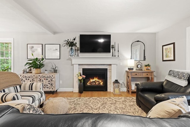 187 Run Brook Cir, Taunton, MA 02780 - living area featuring wood finished floors, a tile fireplace, and beamed ceiling