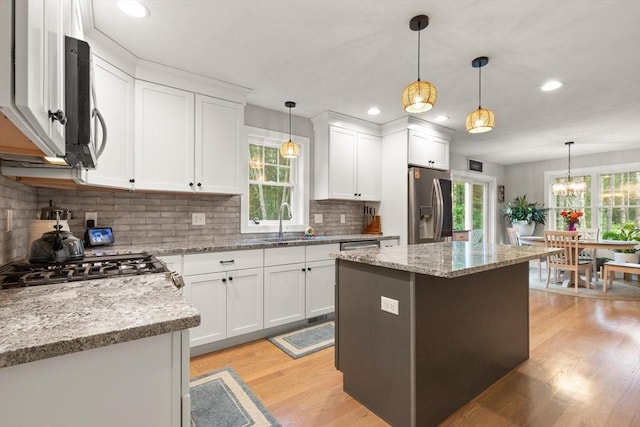 187 Run Brook Cir, Taunton, MA 02780 - kitchen with appliances with stainless steel finishes, light wood-type flooring, white cabinets, backsplash, and recessed lighting