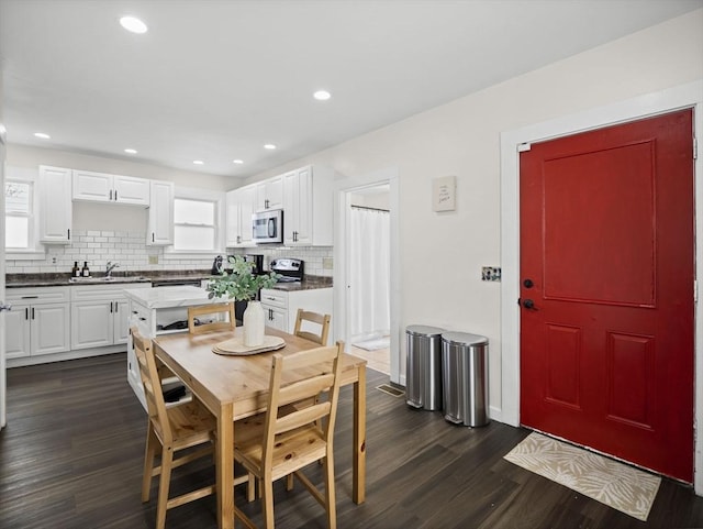 73 Laurel St, Leominster, MA 01453 - dining space with recessed lighting, dark wood finished floors, and plenty of natural light
