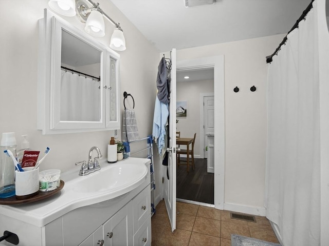 73 Laurel St, Leominster, MA 01453 - bathroom with visible vents, baseboards, tile patterned floors, and vanity