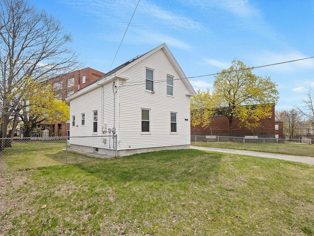 73 Laurel St, Leominster, MA 01453 - view of home's exterior featuring a lawn and fence