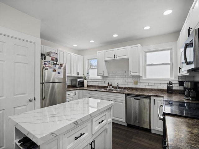 73 Laurel St, Leominster, MA 01453 - kitchen with a sink, appliances with stainless steel finishes, and white cabinets