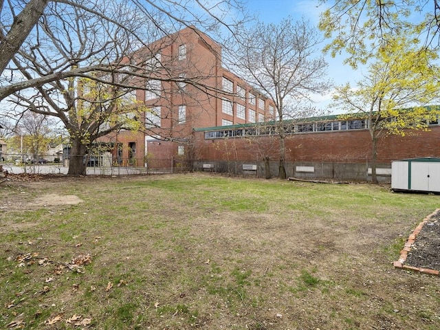73 Laurel St, Leominster, MA 01453 - view of yard featuring fence, an outdoor structure, and a storage shed