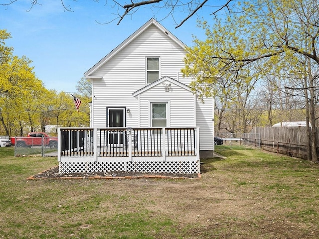 73 Laurel St, Leominster, MA 01453 - rear view of property featuring a lawn, a fenced backyard, and a deck