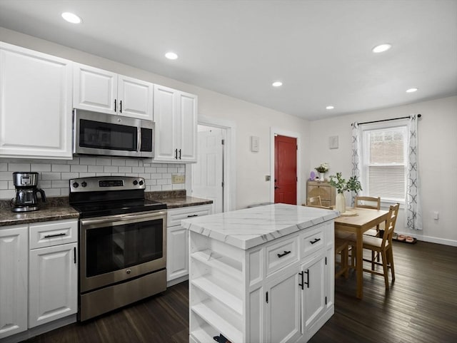 73 Laurel St, Leominster, MA 01453 - kitchen featuring open shelves, dark wood-style flooring, white cabinets, appliances with stainless steel finishes, and backsplash