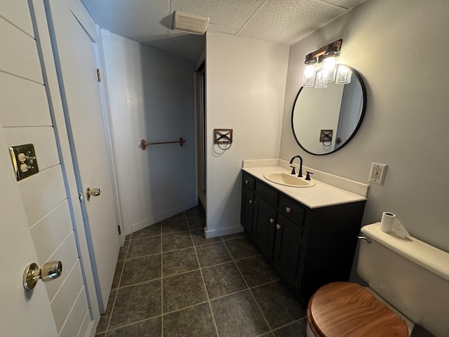 bathroom with toilet and vanity