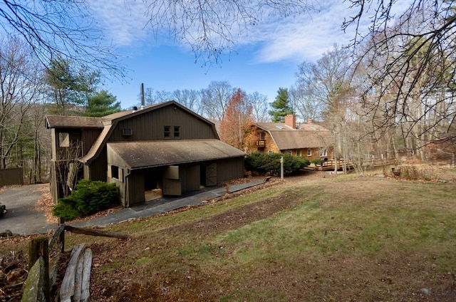 view of side of home featuring a yard