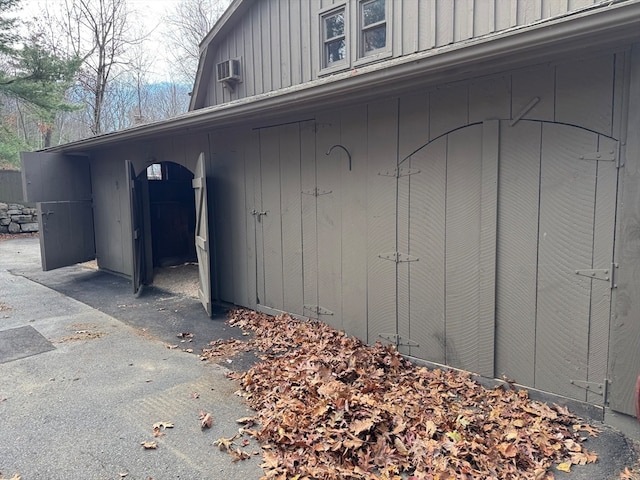 exterior space featuring an AC wall unit