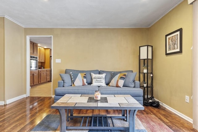 living room with crown molding and hardwood / wood-style floors