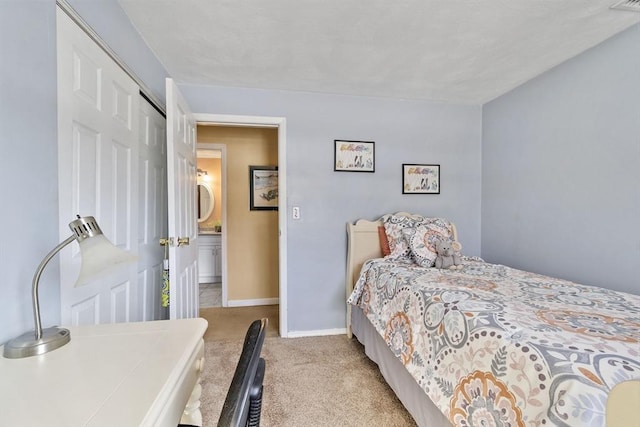 bedroom with light carpet and a closet