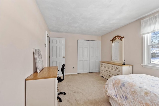 carpeted bedroom featuring a closet