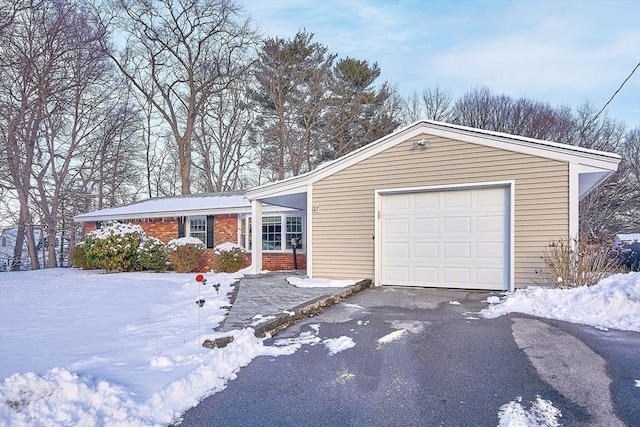 ranch-style home with a garage