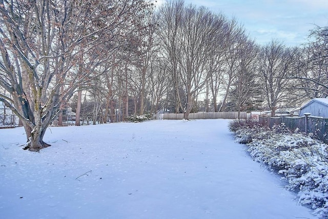 view of yard layered in snow