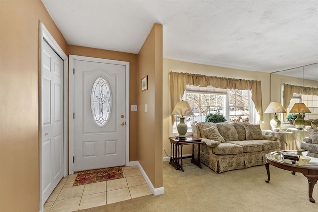 entryway with light colored carpet