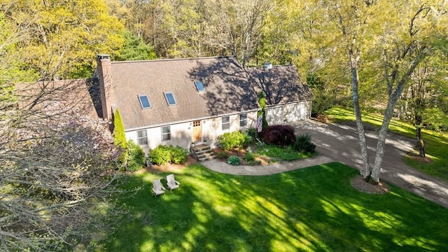 view of subject property featuring a heavily wooded area