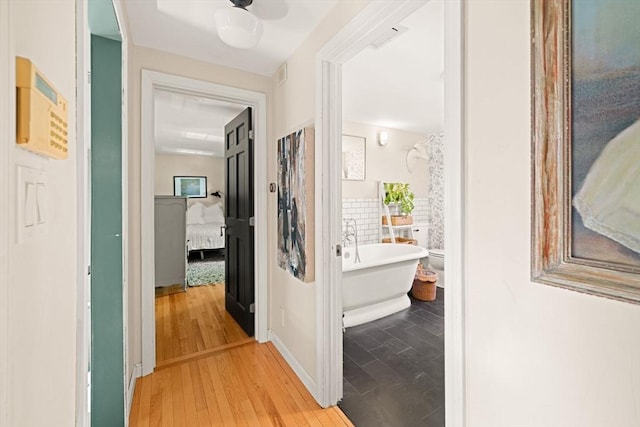 hallway with light wood-style flooring